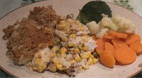 Fish pie on plate with carrot, brocolli and cauliflower