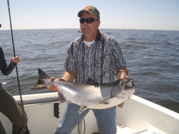 twenty-five pound Chinook landed by Mike of Saskatchewan on the surf line of Barkely Sound Vancouver Island  Guided by John of Slivers "Charters Salmon Sport Fishing