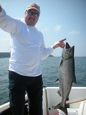 This is Mansel  in the attachment   He is from Calgary and picked up this 23 pound Chinook at Edward King in Barkley Sound. Guide was John of Slivers Charters Salmon Sport Fishing