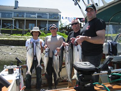 Taja Steve Mark and Leigh show their catch of salmon caught out at the Big Bank off of Ucluelet. Guide was Alan. this was the first trip for this Vancouver B.C. group