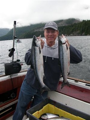 Tom Housholder of Utah shows his two Sockeye caught in Cous Creek located in the Port Alberni Inlet  Sockeye were caught on Black Hooks and pink hootchies  Guide was Doug of Slivers Charters Salmon Sport Fishing