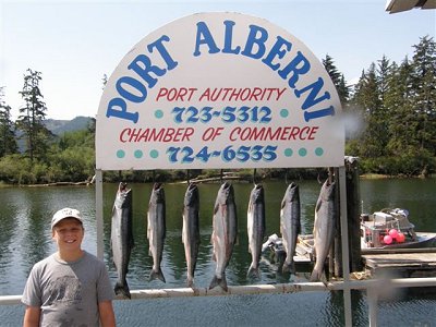 Parker Riggs of Utah  shows some of the catch of Sockeye he and family caught with guide Mel of Slivers Charters Salmon Sport Fishing   All fish were caught in Cous Creek of the Port Alberni Inlet