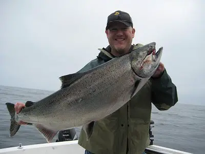 Trevor Porter with his 33 pound Chinook.  Chinook fishing was fantastic just off the surf line of Vancouver Island throughout the summer of 2010.  Trevor was with a group from Calgary Alberta and fished with John of Slivers Charters Salmon Sport Fishing