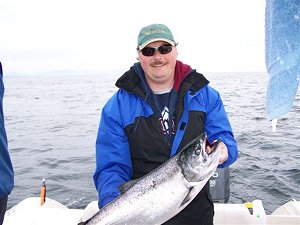 This is a picture of Glenn of Vancouver B.C. who fished the South Bank with guide Wayne.  South Bank is off of the coast line of Vanocuver Island out of Ucluelet B.C. This beautiful Chinook hit a silver glo coyote spoon.  