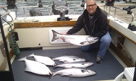 David  with  limits of salmon and halibut landed outside the Ucluelet Harbor in July of 2012.  The salmon fishing season for 2012 looks even more exceptional than the last two years.