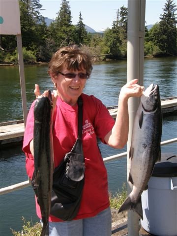 Peggy of Victoria B.C.  shows off two of her Port Alberni Inlet Somass River Sockeye.   Peggy landed both fish using bubblegum hootchies and fished with Doug Lindores of slivers Charters Salmon sport Fishing