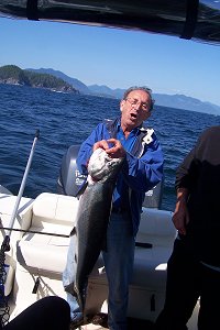 Hank of Cloverdale B.C. shows his Chinook caught just off of Cree Island in Barkley Sound Vancouver Island B.C.   Hanks salmon weighed in at 25 pounds and was caught on an anchovy.  Guide was Wayne