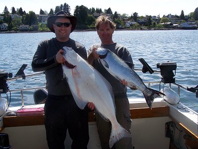 Ed and Graham with halibut and Chinook picked up on Mothers day.  Show the two fish at theUcluelet Harbor located on the west coast of Vancouver Island.  Guide was Al of Ucluelet, B.C.