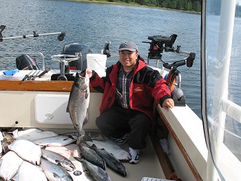 Yuepeng shows his catch of fall salmon and halibut that he caught with friends of the shore of Ucluelet.  Yuepeng was so thrilled with this fishing trip that he and his friends have booked three days of fishing in 2010