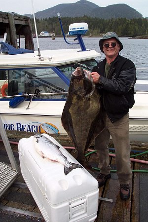 Wayne from Edmonton shows off one of his halibut and small Chinook in the Ucluelet Harbour. Fish were caught at Southbank  on the troll.  Guide was Mike of Ucluelet.