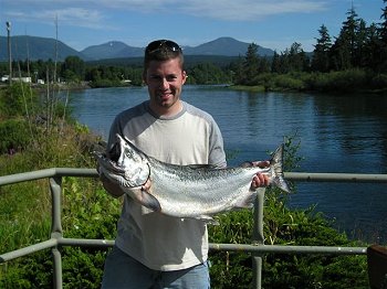 Tyler from Utah shows off 20 pound Chinook picked up at Kirby Point in Barkley Sound with guide from SliversCharters Salmon Sport Fishing