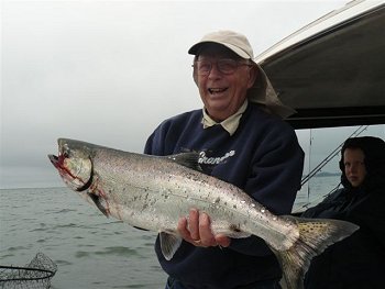 Marque of Fruit Heights U.S.A. displays his Chinook picked up at Kirby Point located in Barkley Sound just outside of Bamfield.  Guide was John of Slivers Charters Salmon Sport Fishing.  Marque had a banner day with four other guests and limited on Chinook in July.