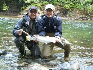 This picture is of Shinibuski of Japan.  He caught this fall steelhead on the Stamp River.  Pictured is Shin and guide Bill.  Shin caught this steelhead fishing on the fly. 