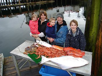 This is a family from Alberta   the Thompsons'   who experienced a great Seafood Safari Day The halibut and rockfish and salmon were caught a few miles out from Ucluelet  The prawns and Crabs were picked up in Barkley Sound close to Mayne Bay.   Guide was Mike Marriott.