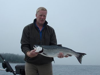 Fall Coho in Barkley Sound.  Coho caught by Fergus on white hootchie with guide John of Slivers Charters Salmon Sport Fishing