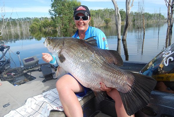 Brooke with a huge barra - barramundi fishing in Australia photos