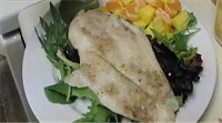 Orange roughy fish fillet with mango and orange salad