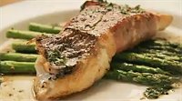 snapper fillet wrapped in procsiutto and served on asparagus