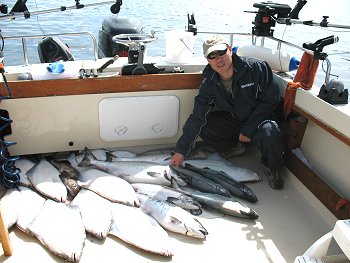 This is YuePeng from Ontario showing catch that he and four friends were thrilled with after a day of fishing the surfline and offshore from Ucluelet and Barkley Sound.  YuePeng was so delighted with his trip he has organized three days for the 2010 year with Slivers Charters Salmon Sport Fishing