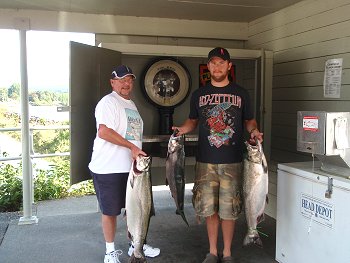 Father and son Tom and Scott show off some of their catch at the Port Alberni, Clutesi Haven Marina weighing station.  Fishing trip in Barkley Sound and the Port Alberni Inlet for the Vancouver men was great. As Tom and Scott and brother Peter explained "We Will be Back"  Group fished with Slivers 'Charters Salmon Sport Fishing.