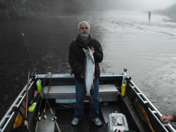 Don of Nanaimo B.C. with one of his Coho landed on the river.  Jet boat fishing has been much better than  walking the beach.  Boats are able to get to the more remote and fast water areas.  Don fished the Stamp River located in Port Alberni B.C. with guide Nick