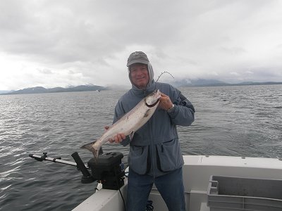 Tom with his feeder Chinook landed using bait fishing around Swale Rock in Barkley Sound