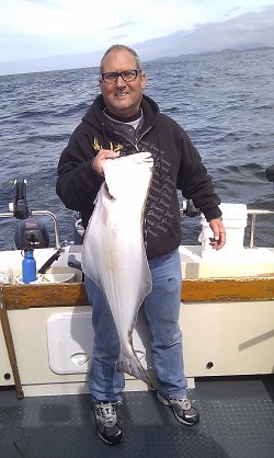 Halibut are migrating from the deepwater to the shallows in the month of May.  There is some fantastic halibut fishing just off of Ucluelet B.C.  David fished with guide Al and had this great hali and some nice feeder Chinook salmon