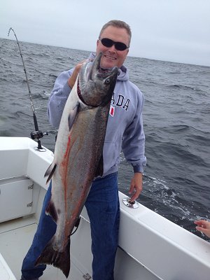 Happy Guest with Chinook Salmon fishing with Slivers Charters Salmon Sport Fishing at the Big Bank located thirty miles out of Bamfield B.C.