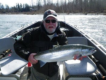 Mick on a guided trip aboard a drift boat in the Upper Stamp River shows his Winter Steelhead which was landed using a four inch pink worm