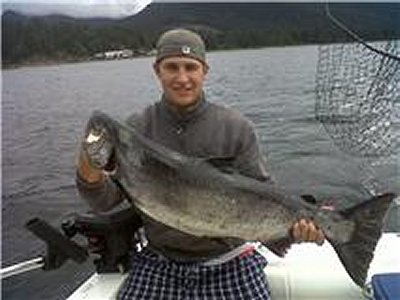 Guide Robert of Slivers Charters Salmon Sport Fishing shows off twenty-eight pound Chinook he hooked into for guuests from Alberta.  Fish hit anchovy at Cape Beale located on surfline of Barkley Sound 