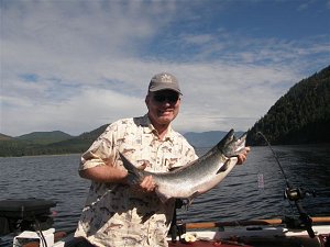 Tom of Port Alberni with his Chinook caught in the the Alberni Inlet with guide from Slivers Charters.   This fish was caught with an AORL 12 hootchie