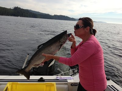 Crystal from Vancouver Island shows one of her many salmon her and family landed on an mid September fishing day off the Bamfield Wall.  Crystal and family were guided by Doug of Slivers Charters.  This salmon was land using a purple Haze hootchie.