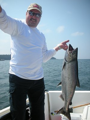 Mansel of Calgary Alberta landed a great twenty three pound Chinook out a Edward King Island located on the surf line of Barkley Sound.  This fish was landed using anchovy in a green haze Rhys Davis teaser head