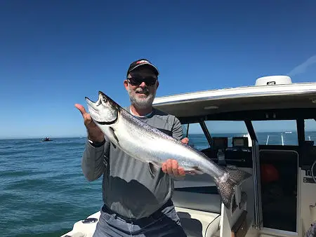 Bruce fished with Slivers Charters. This Chinook was landed offshore using a small coyote spoon. Guide was John