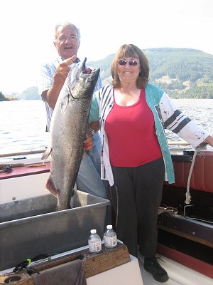 Guide Mel of Slivers Charters Salmon Sport Fishing with Guest Allyn and her big Chinook landed using a green spatter back hootchie.  Fishing in the Barkley Sound and offshore areas of West Vancouver Island has been very good since late May into mid June.  We  are expecting a great summer of fishing