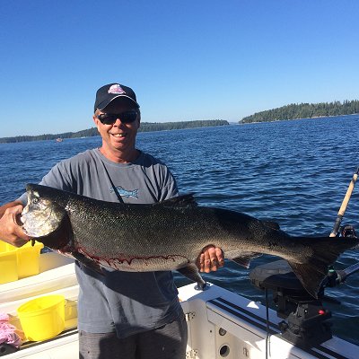 Doug of Slivers Chartes Salmon Sport Fishing with 31 pound Chinook landed by guests outside the Bamfield Harbor Mouth