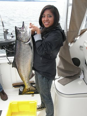 Laura from Ontario with dad landed this 22 pound Chinook on the surfline of Barkley Sound located on Vancouver Island.  Chinook was in 100 feet of water at Austin Island and hit a army truck hootchie 