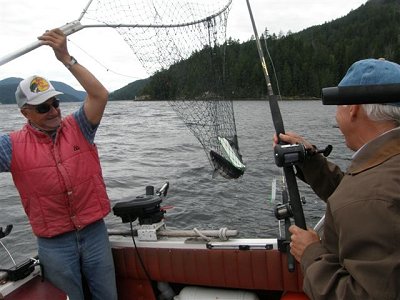 Guide Mel of Slivers Charters Salmon sport Fishing nets a beautiful Alberni Inlet Sockeye for guests