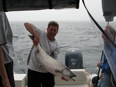 Ed of Delta B.C. shows his big Chinook caught with guide Wayne just off of Austin island in Barkley Sound Vancouver Island.   Ed landed his Chinook on a cop car coyote spoon behind a green hotspot flasher.