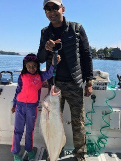 Rahul and daughter from Nevada have a nice halibut landed outside of Ucluelet.