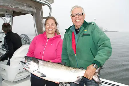 Jessica and dad John with Chinook salmon landed at Cree Island In Barkley Sound. Salmon hit anchovy in a Green haze Rhys Davis Teaser Head. Guide was Doug of Slivers Charters Salmon Sport fishing