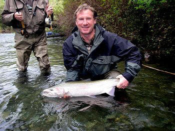 Ian Galland and his beautiful silver fall Steelhead caught on the fly. 