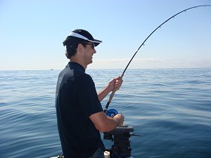 The water on the west coast of Vancouver Island can be pleasant.  On a beautiful June morning Owen plays a Chinook Salmon in calm and very peaceful water.