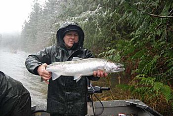 Guest Richard of Idaho on a snowy day on the Stamp River outside Port Alberni B.C. with a Winter Steelhead. Guide was Matt.