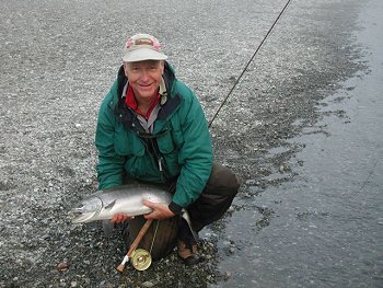Guest Mike of Oregon with his fish in October on the Stamp. Fishing in the fall on the Stamp can be terriffic. Those who are fly fishermen enthusiasts are often in heaven