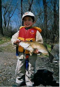 "Conservationist" Levi Lumbroso with a nice smallmouth bass caught on a live minnow in May 2006 on the Outaouais / Ottawa river. It was live released in good health as they were still out of season.