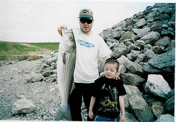 Freshwater Phil Lumbroso with a nice striper caught in Lake Texoma