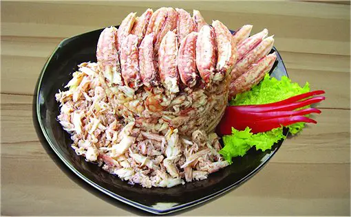 Claw Crabmeat. Claw and leg meat, with whole claw and legs packed on the top and bottom of the can, and shredded leg meat in between.